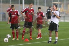 2. BL - FC Ingolstadt 04 - Saison 2013/2014 - Trainingsauftakt - Cheftrainer Marco Kurz gibt Anweisungen bei vollem Regen