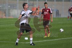 2. BL - FC Ingolstadt 04 - Saison 2013/2014 - Trainingsauftakt - Cheftrainer Marco Kurz gibt Anweisungen bei vollem Regen