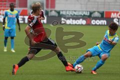 2. Bundesliga - Testspiel - FC Ingolstadt 04 - 1. FC Köln - Lukas Hinterseer (16) gegen rechts Yuya Osako