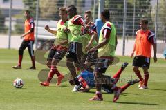 2. Bundesliga - FC Ingolstadt 04 - Saison 2014/2015 - Auftakttraining - Spielszene Roger de Oliveira Bernardo (8) mit Neuzugängen Lukas Hinterseer (16) und Steffen Jainta am Boden