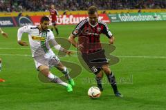 1. Bundesliga - Fußball - Borussia Mönchengladbach - FC Ingolstadt 04 -Lukas Hinterseer (16, FCI) gegen Alvaro Dominguez (15, Mönchengladbach). Foto: Adalbert Michalik