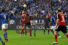 1. Bundesliga - Fußball - FC Schalke 04 - FC Ingolstadt 04 - Romain Brégerie (18, FCI) gewinnt das Kopfballduell gegen Sead Kolasinac (6, Schalke). Foto: Adalbert Michalik