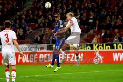 1. Bundesliga - Fußball - 1. FC Köln - FC Ingolstadt 04 -  Tomas Pekhart (11, FCI) gewinnt das Kopfballduell gegen Frederik Sörensen (4, FC Köln). Dominique Heintz (3, FCKöln) schaut zu. Foto: Adalbert Michalik