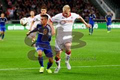 1. Bundesliga - Fußball - 1. FC Köln - FC Ingolstadt 04 - Stefan Lex (14, FCI) mit Frederik Sörensen (4,Köln) im Kampf um den Ball. Foto: Adalbert Michalik