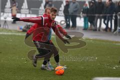 1. Bundesliga - Fußball - FC Ingolstadt 04 - Trainingsauftakt nach Winterpause - Max Christiansen (19, FCI) und hinten Moritz Hartmann (9, FCI)