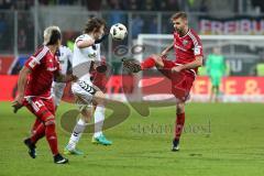 1. Bundesliga - Fußball - FC Ingolstadt 04 - SC Freiburg - Lukas Hinterseer (16, FCI) nimmt den Ball in der Luft, links Söyüncü, Caglar (4 Freiburg)