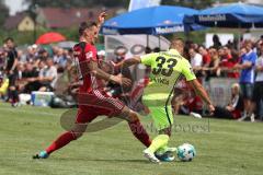 2. Bundesliga - Fußball - Testspiel - FC Ingolstadt 04 - SV Wehen Wiesbaden - Stefan Kutschke (20, FCI) und rechts Sebastian Mrowca (WW)