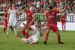 2. Bundesliga - Fußball - SV Wehen Wiesbaden - FC Ingolstadt 04 - Darío Lezcano (11, FCI) wird zu Fall gebracht, links Sebastian Mrowca (10 SVW) und rechts Sascha Mockenhaupt (4 SVW)