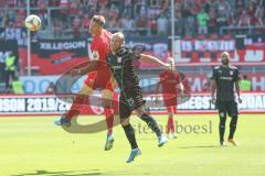 3. Fußball-Liga - Saison 2019/2020 - FC Ingolstadt 04 - Hallescher FC - Stefan Kutschke (#30,FCI)  - Björn Jopek (#25 HFC) - Foto: Meyer Jürgen
