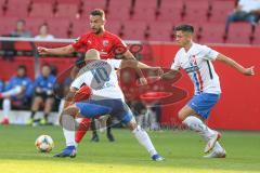 3. Fußball-Liga - Saison 2019/2020 - FC Ingolstadt 04 - Hansa Rostock - Fatih Kaya (#9,FCI)  - Korbinian Vollmann (#10 Rostock) - Foto: Meyer Jürgen