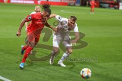 3. Fußball-Liga - Saison 2019/2020 - FC Ingolstadt 04 -  SpVgg Unterhaching - Ganiggia Ginola Elva (#14,FCI)  - Sascha Bigalke (#21 Unterhaching) - Max Dombrowka (#8 Unterhaching) - Foto: Meyer Jürgen