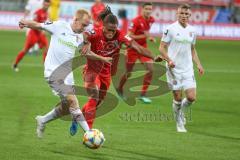 3. Fußball-Liga - Saison 2019/2020 - FC Ingolstadt 04 -  SpVgg Unterhaching - Ganiggia Ginola Elva (#14,FCI)  - Sascha Bigalke (#21 Unterhaching) - Foto: Meyer Jürgen