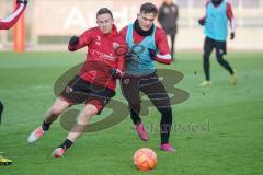 3. Liga - FC Ingolstadt 04 - Trainingsauftakt nach Winterpause - Marcel Gaus (19, FCI) Dennis Eckert Ayensa (7, FCI) Zweikampf