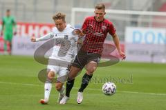 3. Fußball-Liga - Saison 2020/2021 - FC Ingolstadt 04 - SpVgg Unterhaching - Gordon Büch (#18,FCI) - Luca Marseiler (#30 Unterhaching) - Foto: Meyer Jürgen