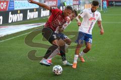 3. Fußball-Liga - Saison 2020/2021 - FC Ingolstadt 04 -  KFC Uerdingen - Justin Butler (#31,FCI) - Gino Fechner (#16 Uerdingen) - Foto: Meyer Jürgen