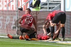 3. Fußball-Liga - Saison 2020/2021 - FC Ingolstadt 04 -  KFC Uerdingen - Björn Paulsen (#4,FCI)  verletzt am Boden - Robin Krausse (#23,FCI)  - Foto: Meyer Jürgen