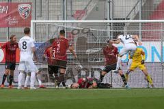 3. Fußball-Liga - Saison 2020/2021 - FC Ingolstadt 04 - SC Verl - Torwart Fabijan Buntic (#24,FCI)  - Julian Stöckner (#23 Verl) mit einem Kopfball im Strafraum - Dominik Franke (#3,FCI) verletzt am Boden - Foto: Meyer Jürgen