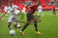 3. Fußball-Liga - Saison 2020/2021 - FC Ingolstadt 04 - SpVgg Unterhaching - Ganiggia Ginola Elva (#14,FCI)  - Alexander Fuchs (#35 Unterhaching) - Foto: Meyer Jürgen