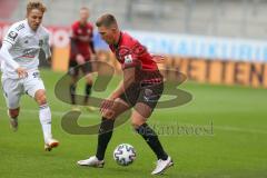 3. Fußball-Liga - Saison 2020/2021 - FC Ingolstadt 04 - SpVgg Unterhaching - Gordon Büch (#18,FCI) - Luca Marseiler (#30 Unterhaching) - Foto: Meyer Jürgen