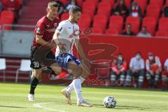 3. Fußball-Liga - Saison 2020/2021 - FC Ingolstadt 04 -  KFC Uerdingen - Stefan Kutschke (#30,FCI)  - Stefan Velkow (#13 Uerdingen) - Foto: Meyer Jürgen