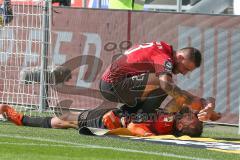 3. Fußball-Liga - Saison 2020/2021 - FC Ingolstadt 04 -  KFC Uerdingen - Björn Paulsen (#4,FCI)  verletzt am Boden - Robin Krausse (#23,FCI)  - Foto: Meyer Jürgen