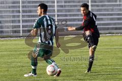 Manuel Ott schiesst am Schweinfurter Eray Cadiroglu vorbei aufs Tor. Aufgenommen am 29.04.2011 im Ingolstädter TUJA Stadion beim Spiel FCI 2 gegen FC Schweinfurt 05.