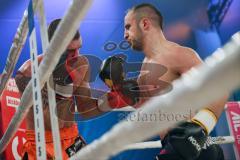 Kickboxen - Thaiboxen - Stekos Fight Night - WKU Weltmeisterschaft (5 x 3 min.) Thaiboxen K1 - 76 kg - Dardan Morina (GER) vs. Michal Halada (SVK) - Dardan Morina im Angriff trifft mit voller Wucht