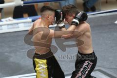 Kickboxen - Deutsche Meisterschaft Pro Amateure Jugend VK-48 Kg - schwarze Hose Homer Richard vom Kickboxtempel Ingolstadt - gelbe Hose Mezineler Kerem Can von Team Sharks Sindelfingen - Foto: Jürgen Meyer